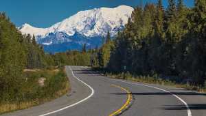 The Alaska Highway with mountain in background
